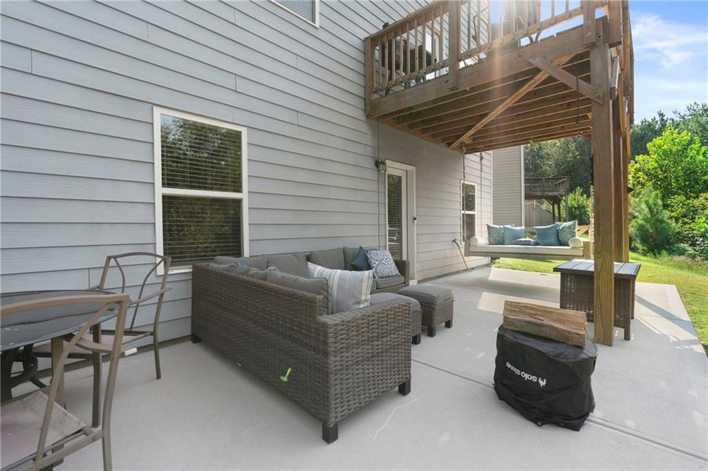 511 Autumn Echo Canton, GA 30114 - Photo 36 of 45 a view of a patio with couches chairs and a barbeque