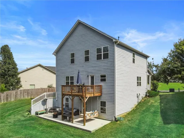 a view of a chairs and table in patio