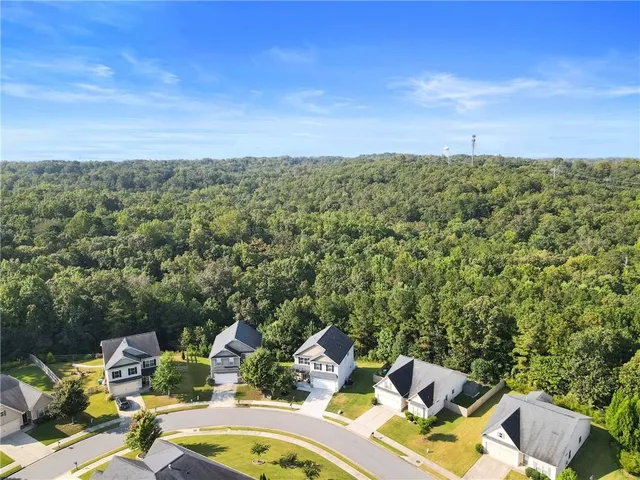 a view of a two chairs in a backyard