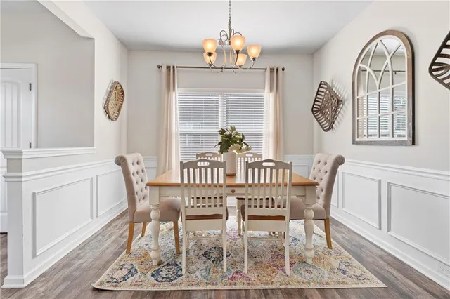 a view of a dining area with furniture and a large window