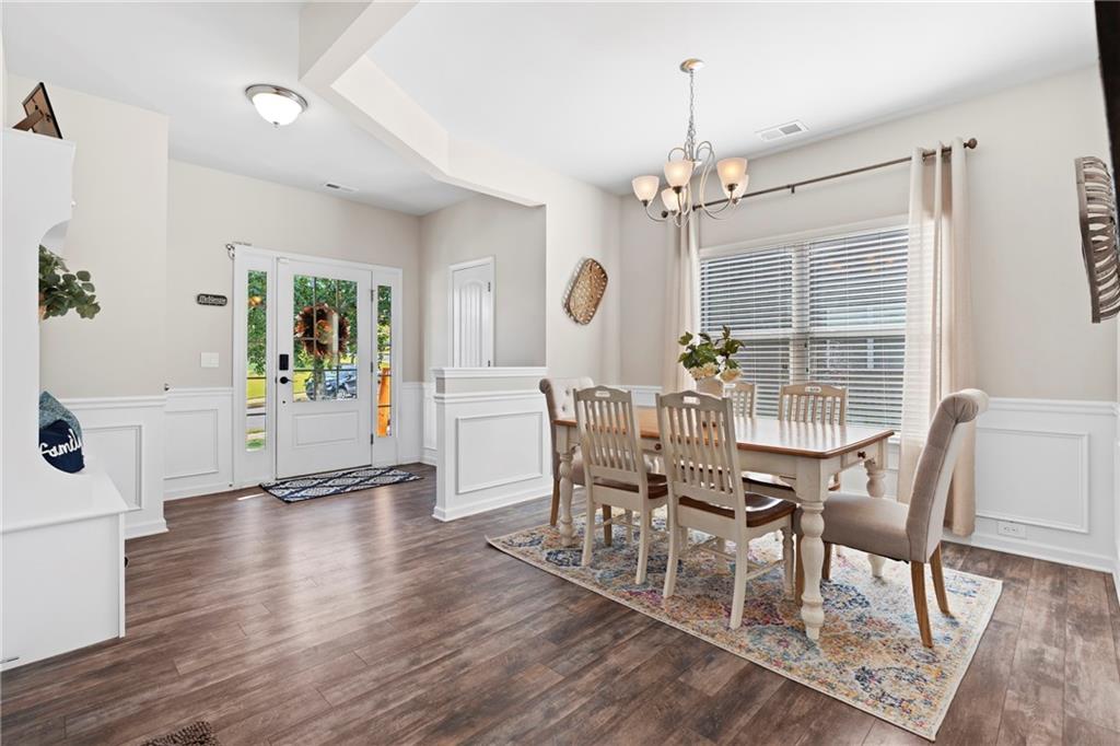 511 Autumn Echo Canton, GA 30114 - Photo 7 of 45 a view of a dining room with furniture window and wooden floor