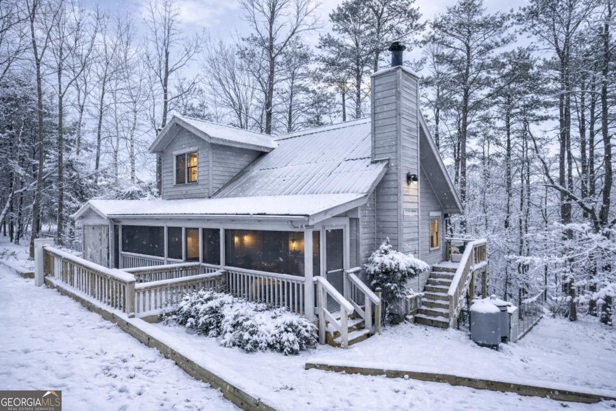 front view of a house with large trees