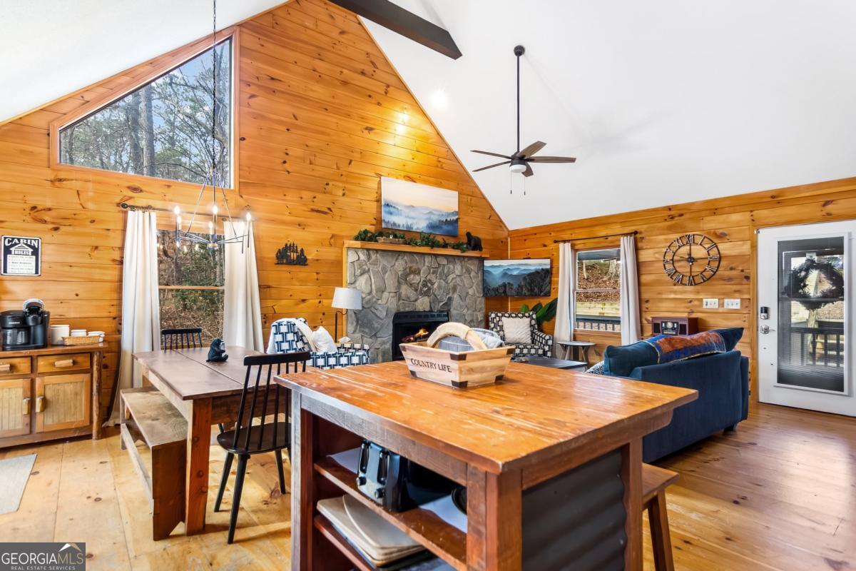 174 Seneca Way, Unit 116 Ellijay, GA 30540 - Photo 11 of 39 a view of a dining room with furniture window and wooden floor