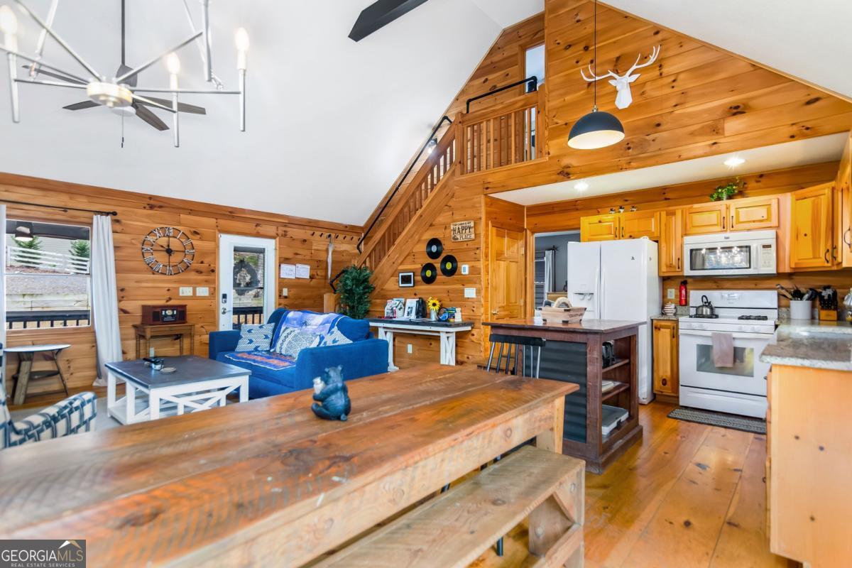 174 Seneca Way, Unit 116 Ellijay, GA 30540 - Photo 12 of 39 a kitchen with stainless steel appliances kitchen island granite countertop a sink and cabinets