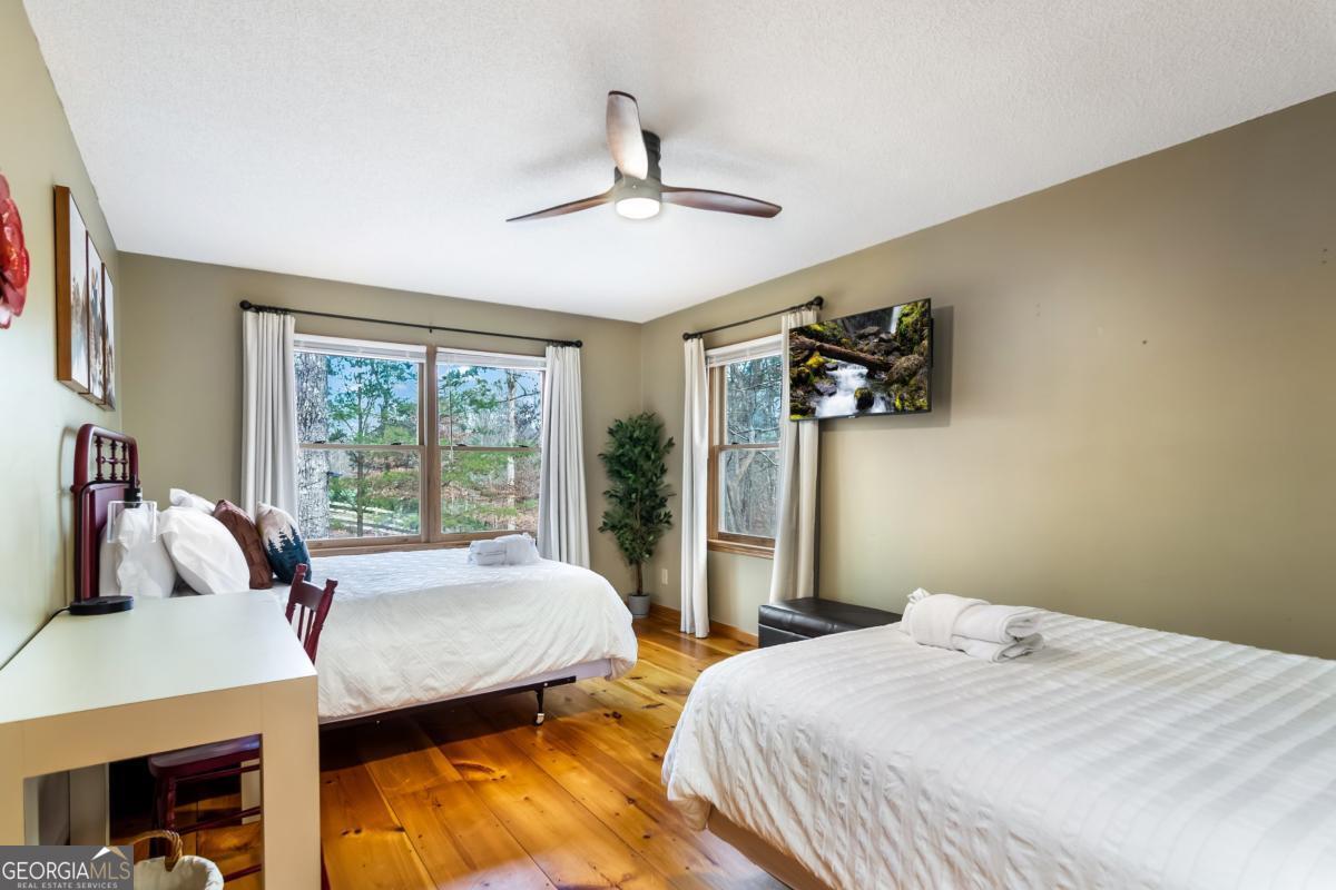 174 Seneca Way, Unit 116 Ellijay, GA 30540 - Photo 16 of 39 a bedroom with a bed and a window