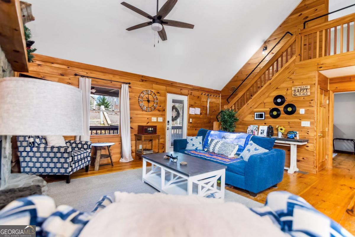 174 Seneca Way, Unit 116 Ellijay, GA 30540 - Photo 20 of 39 a living room with furniture and wooden floor