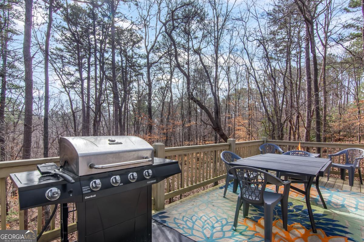174 Seneca Way, Unit 116 Ellijay, GA 30540 - Photo 27 of 39 a view of a dinning tables and chairs in the patio