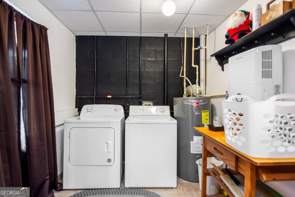 174 Seneca Way, Unit 116 Ellijay, GA 30540 - Photo 29 of 39 a utility room with dryer and washer