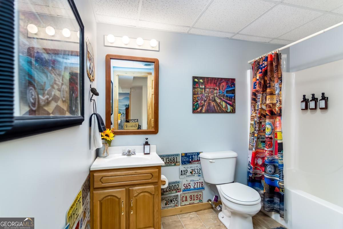 174 Seneca Way, Unit 116 Ellijay, GA 30540 - Photo 31 of 39 a bathroom with a sink a toilet and a shower