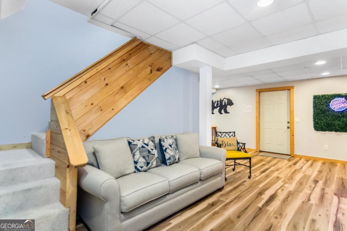174 Seneca Way, Unit 116 Ellijay, GA 30540 - Photo 33 of 39 a living room with furniture and a flat screen tv