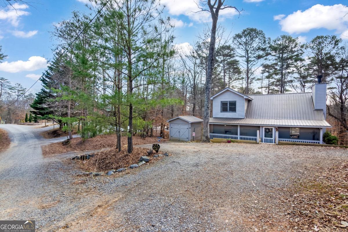 174 Seneca Way, Unit 116 Ellijay, GA 30540 - Photo 6 of 39 a view of a house with a yard and sitting area