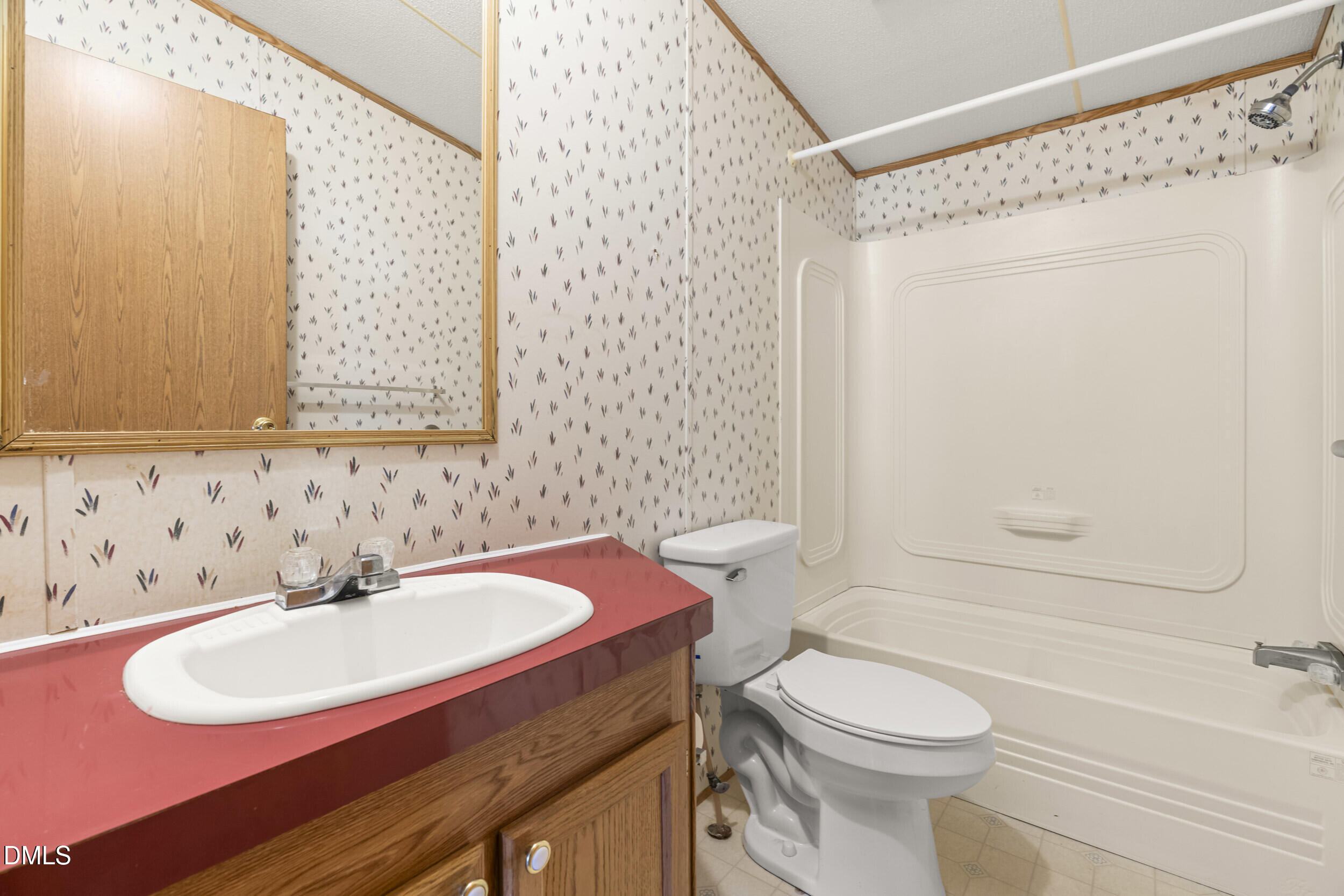 106 Roe Lane Clayton, NC 27527 - Photo 18 of 24 a bathroom with a sink toilet and shower