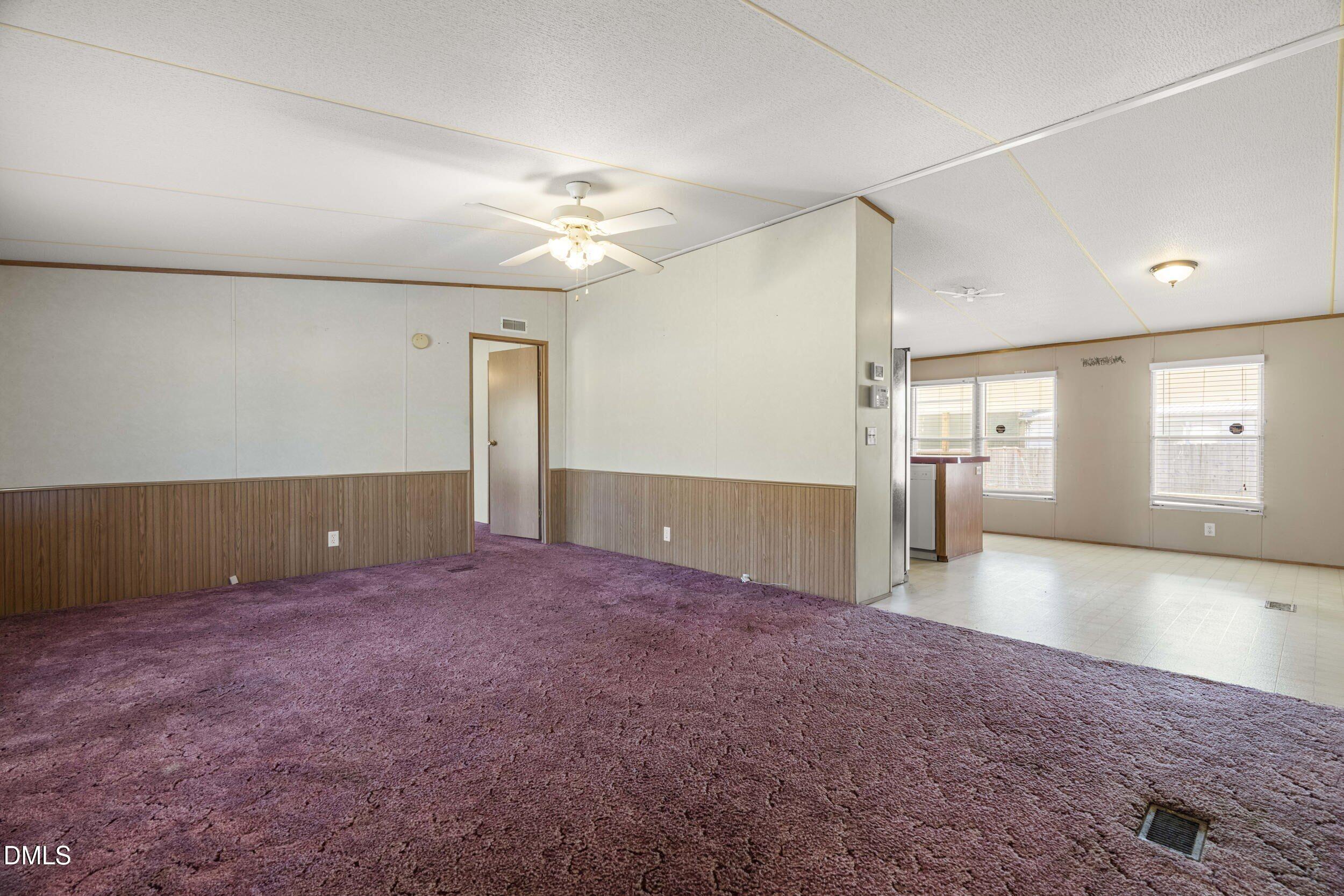 106 Roe Lane Clayton, NC 27527 - Photo 7 of 24 wooden floor in an empty room with a window