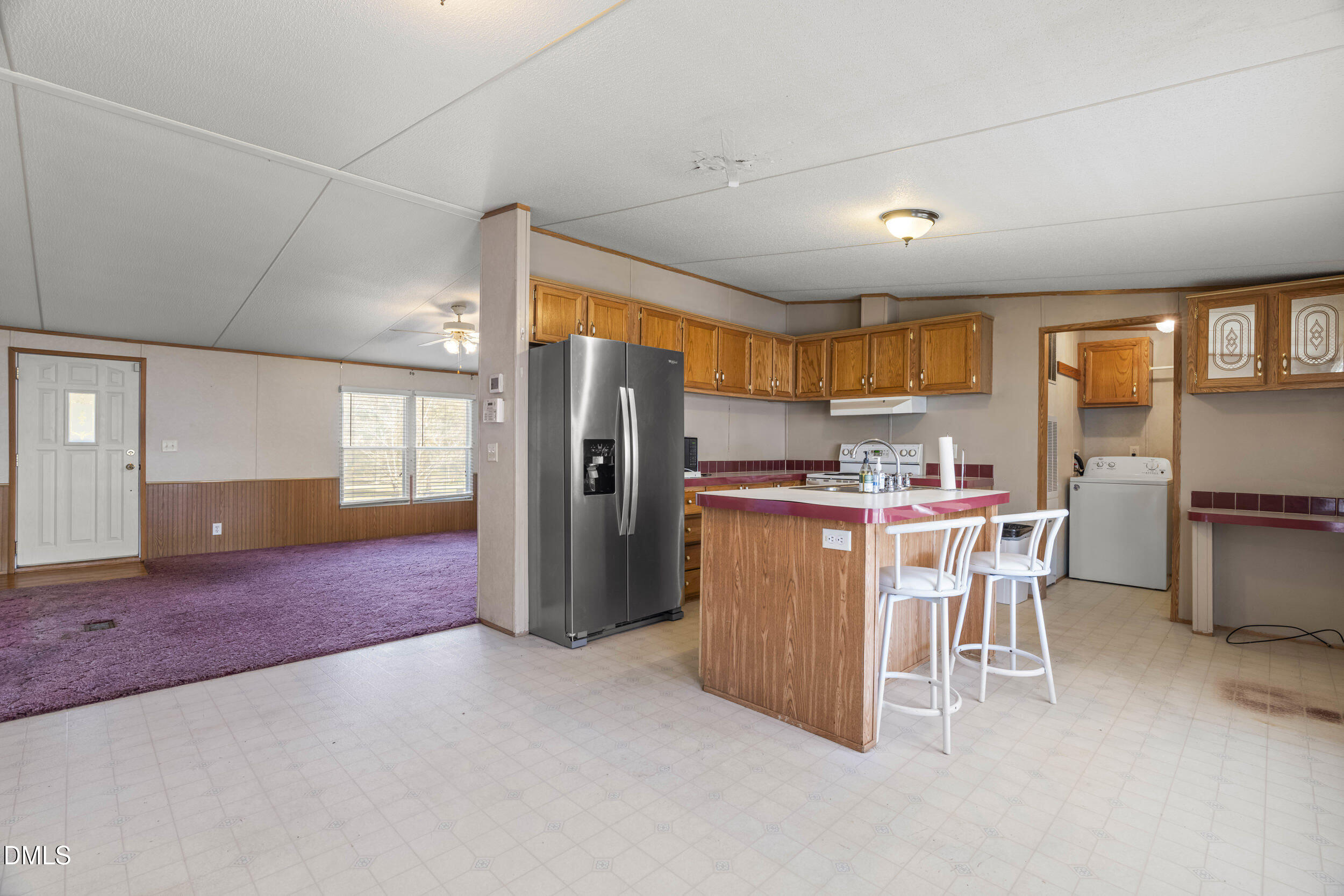106 Roe Lane Clayton, NC 27527 - Photo 8 of 24 a kitchen with refrigerator and window