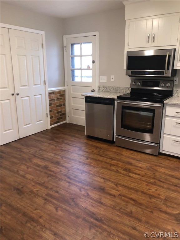 11636 River Road Chesterfield, VA 23838 - Photo 12 of 50 a kitchen with wooden floors and black appliances