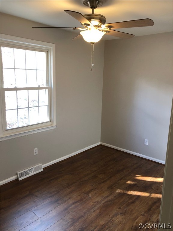 11636 River Road Chesterfield, VA 23838 - Photo 20 of 50 an empty room with wooden floor fan and windows