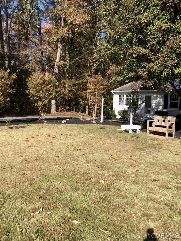 11636 River Road Chesterfield, VA 23838 - Photo 47 of 50 a backyard of a house with table and chairs