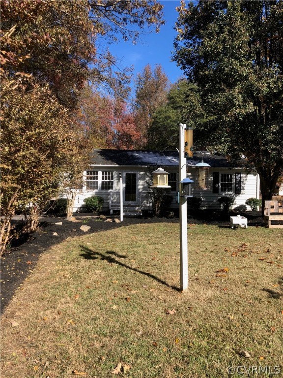 11636 River Road Chesterfield, VA 23838 - Photo 6 of 50 a front view of a house with a yard and garage