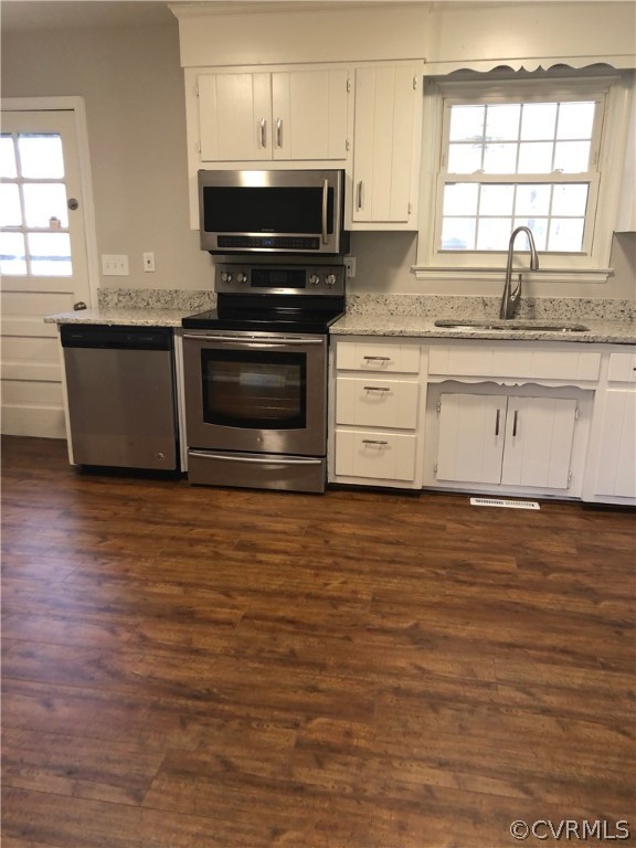 11636 River Road Chesterfield, VA 23838 - Photo 8 of 50 a kitchen with stainless steel appliances granite countertop a stove a sink and a microwave