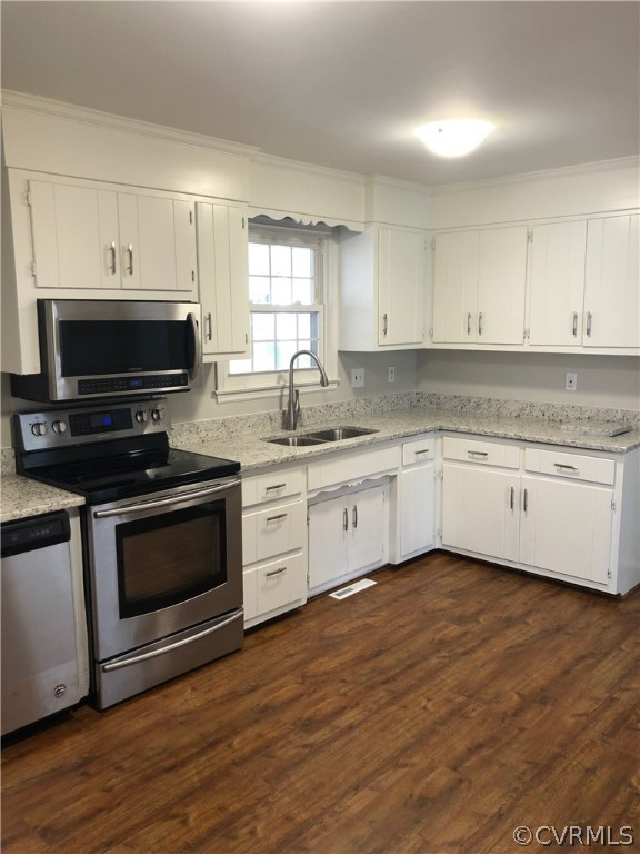 11636 River Road Chesterfield, VA 23838 - Photo 9 of 50 a kitchen with granite countertop a stove a sink and cabinets