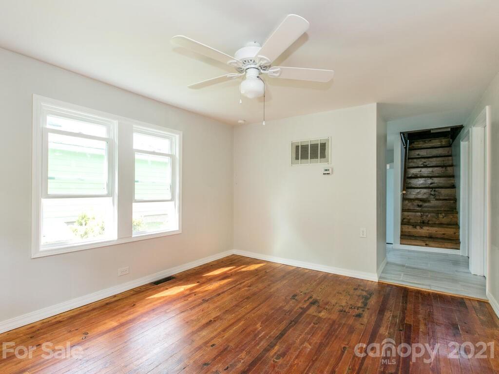 39 Sellers Road Clyde, NC 28721 - Photo 14 of 33 wooden floor in an empty room with a window