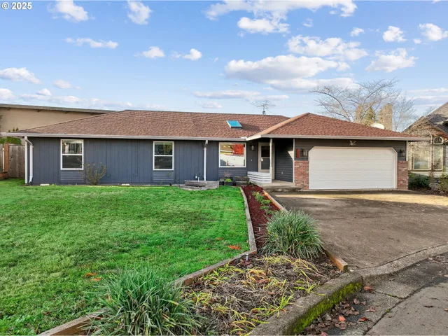 a front view of a house with a garden