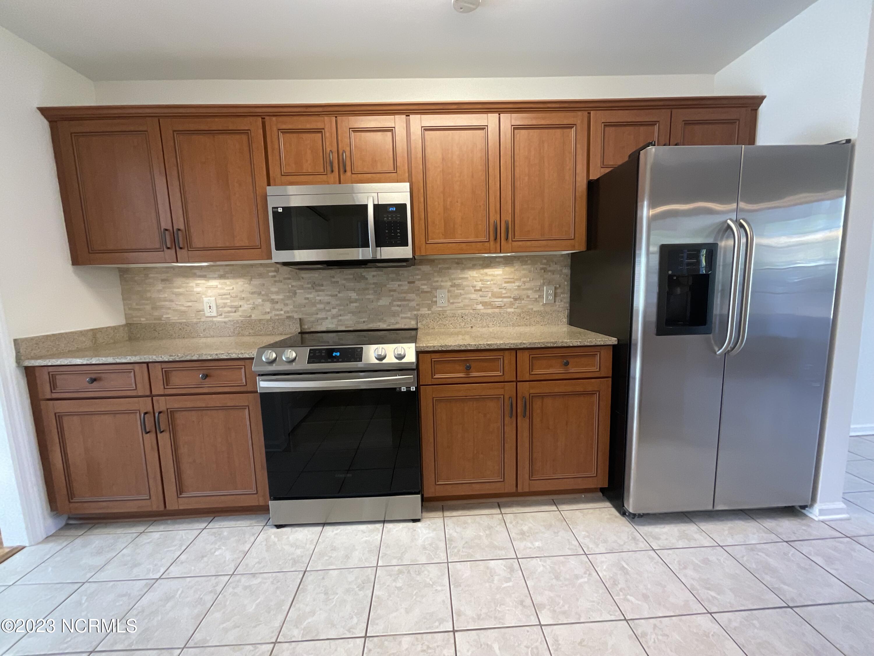 5253 Woods Edge Road Wilmington, NC 28409 - Photo 8 of 22 Granite counters and new appliances