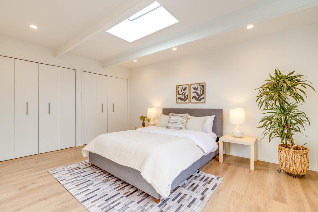 51 Asta Drive La Selva Beach, CA 95076 - Photo 18 of 43 a bedroom with a large bed and a potted plant