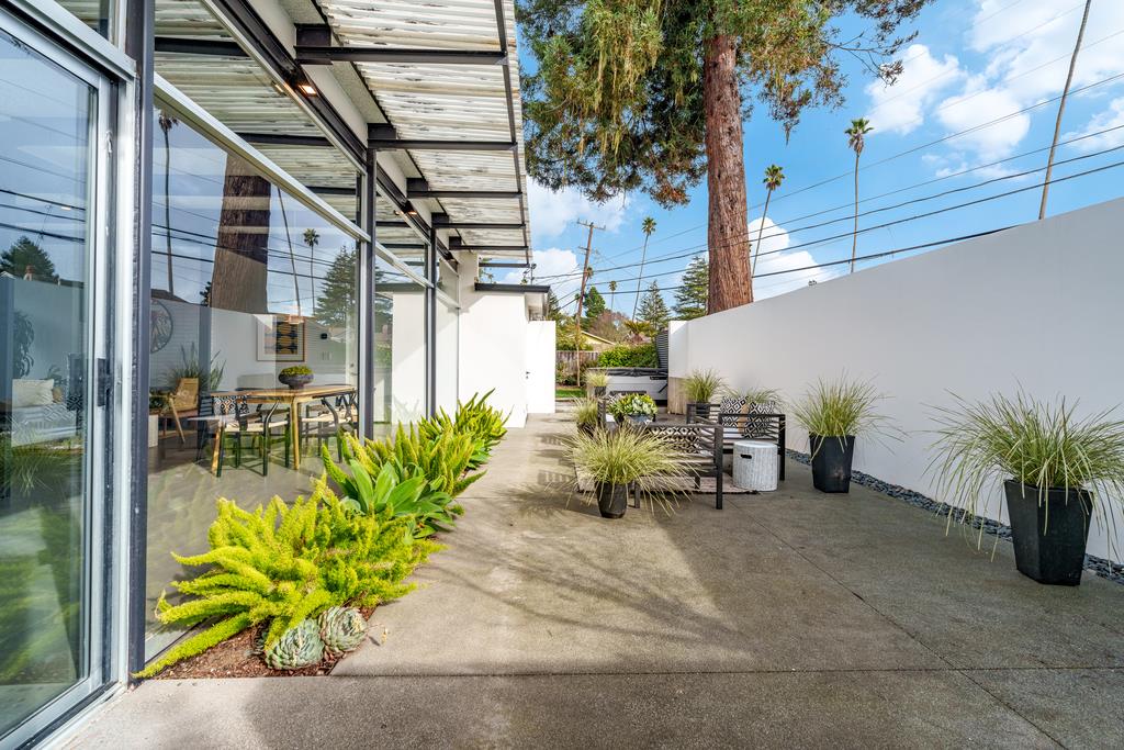 51 Asta Drive La Selva Beach, CA 95076 - Photo 32 of 43 a table and chairs with potted plants and wooden fence
