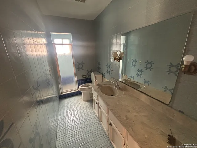 a view of a hallway with wooden floor and stairs