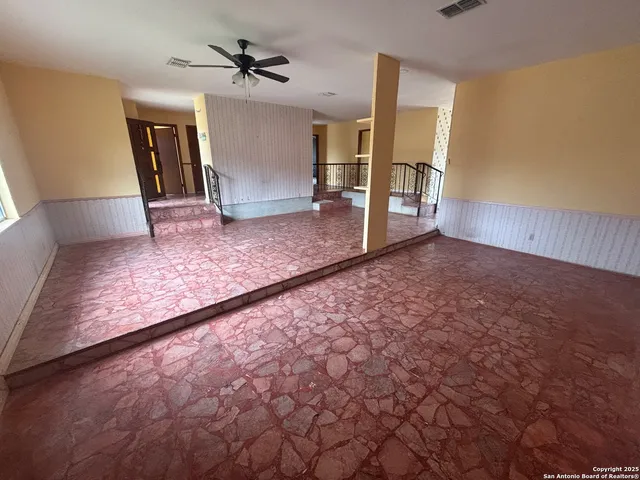a view of a livingroom with a staircase