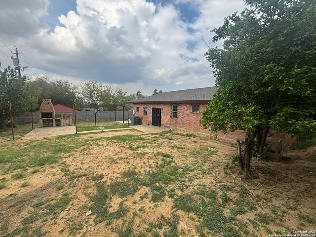 a front view of a stone house
