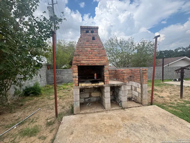 a view of a patio with a fountain
