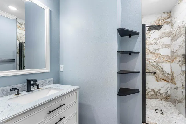 an empty room with a window and wooden floor