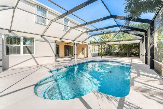 a view of a swimming pool with a patio