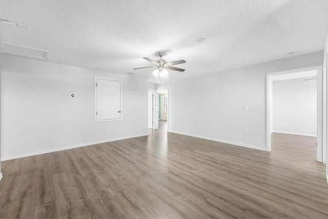 a view of a bathroom with a sink and a mirror