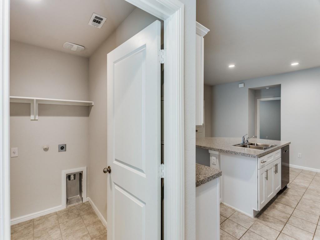 233 Abingdon Street Azle, TX 76020 - Photo 6 of 12 Laundry room featuring recessed lighting, gas dryer hookup, light tile patterned floors, and electric dryer hookup