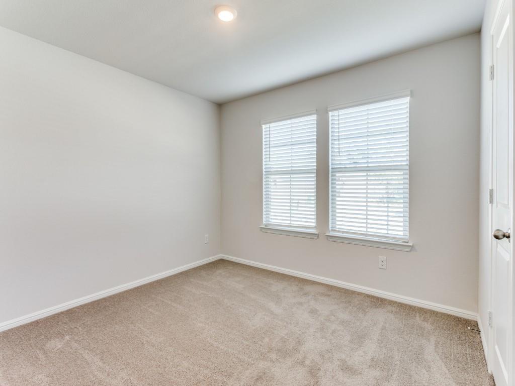 233 Abingdon Street Azle, TX 76020 - Photo 7 of 12 Unfurnished room featuring baseboards and light colored carpet