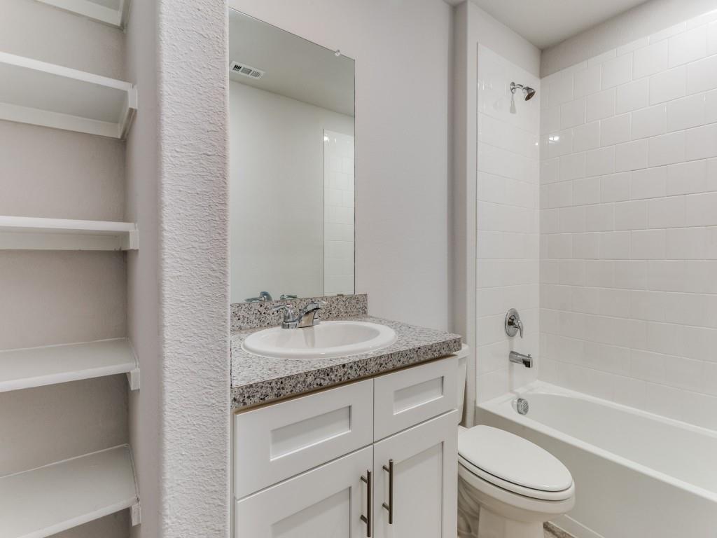 233 Abingdon Street Azle, TX 76020 - Photo 8 of 12 Bathroom featuring vanity and bathing tub / shower combination