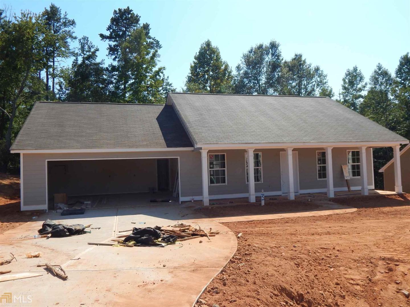 91 Heather Lane Commerce, GA 30529 - Photo 1 of 1 a front view of house with yard and trees in the background