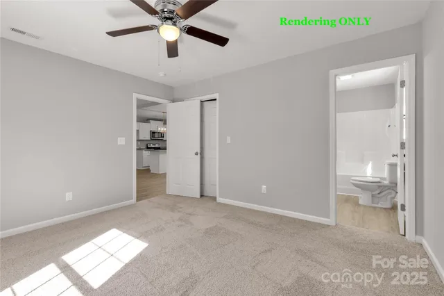 a bathroom with a granite countertop toilet sink and mirror