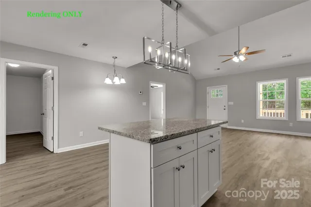 a view of a kitchen with granite countertop cabinets a sink dishwasher and a large window
