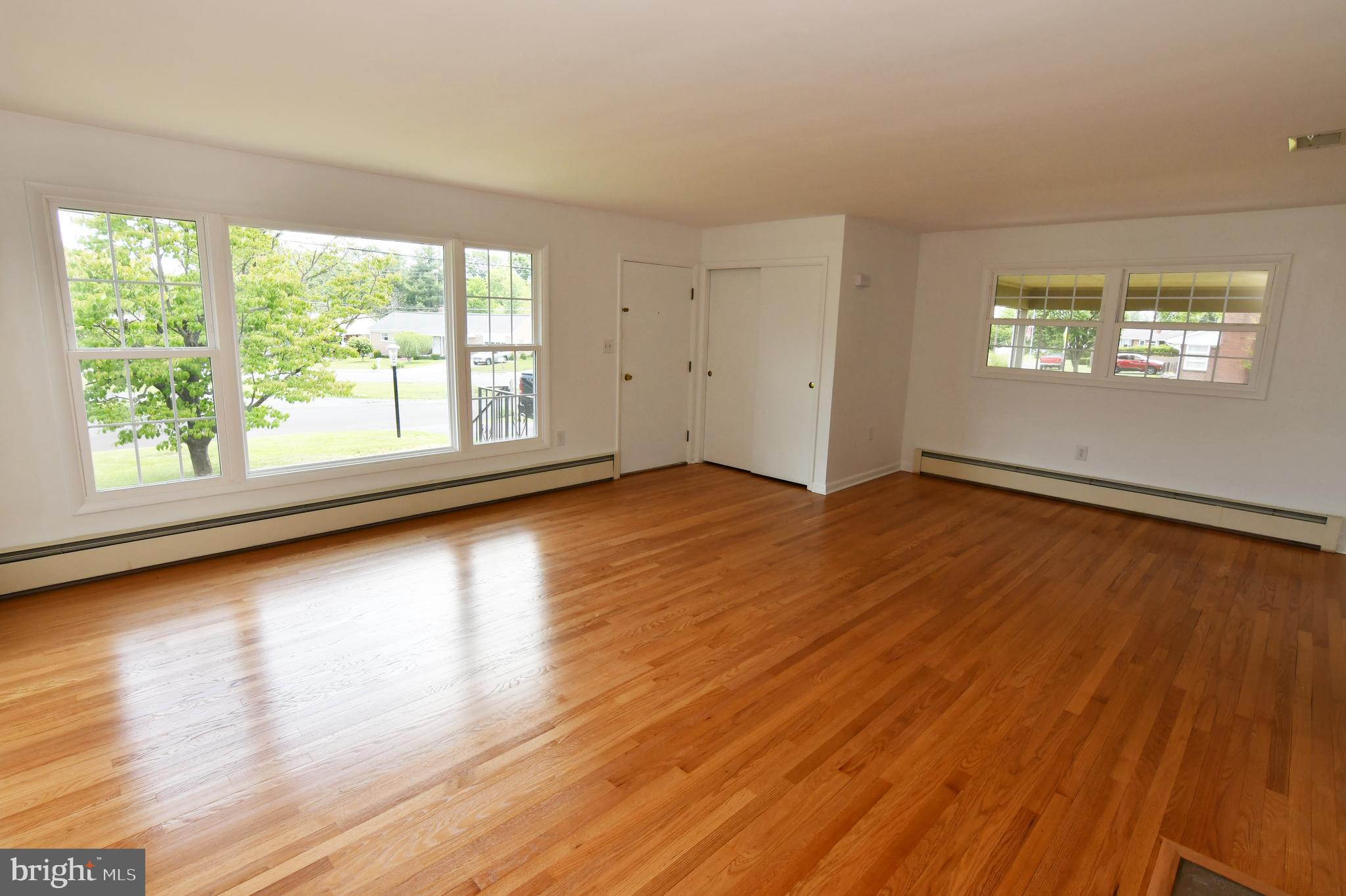 437 Beechcroft Road Winchester, VA 22601 - Photo 12 of 52 an empty room with wooden floor and windows