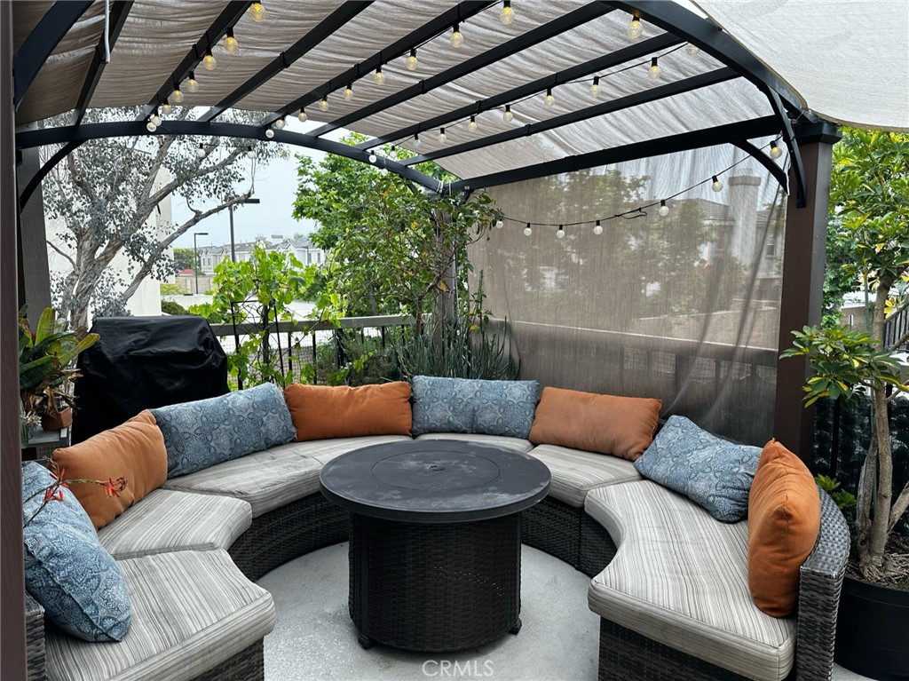 9051 Cobblestone Lane, Unit 40 Cypress, CA 90630 - Photo 1 of 38 a outdoor living space with furniture and a potted plant