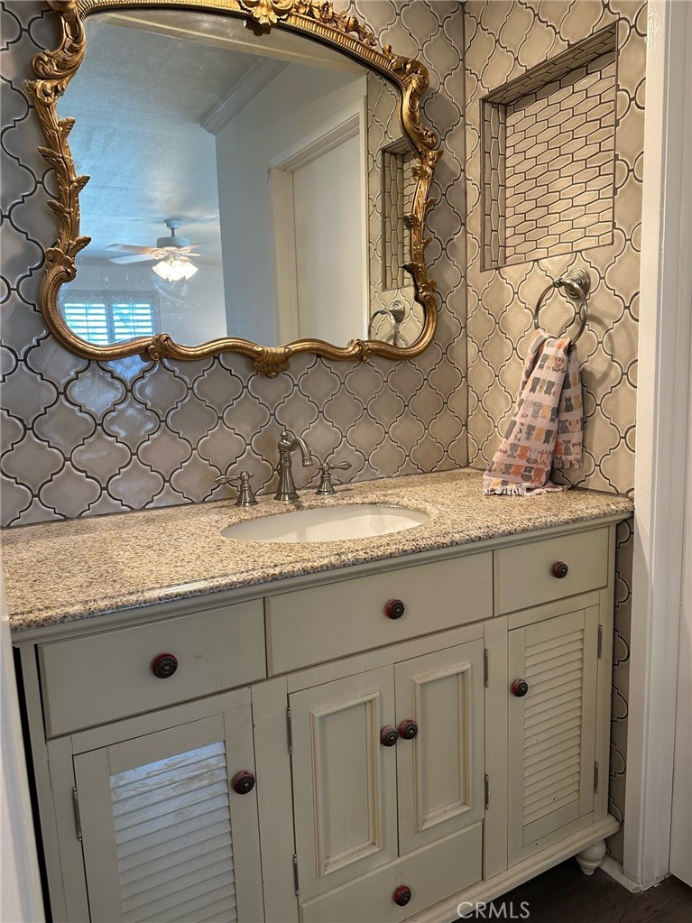 9051 Cobblestone Lane, Unit 40 Cypress, CA 90630 - Photo 13 of 38 a bathroom with a sink and a mirror