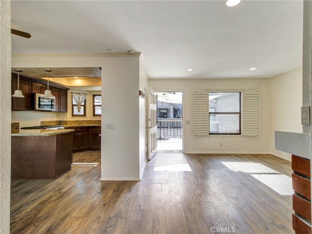 9051 Cobblestone Lane, Unit 40 Cypress, CA 90630 - Photo 16 of 38 a view of a kitchen with wooden floor and a kitchen
