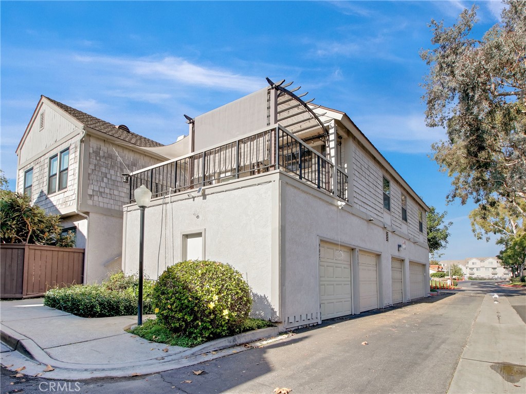 9051 Cobblestone Lane, Unit 40 Cypress, CA 90630 - Photo 25 of 38 a view of a house with a street