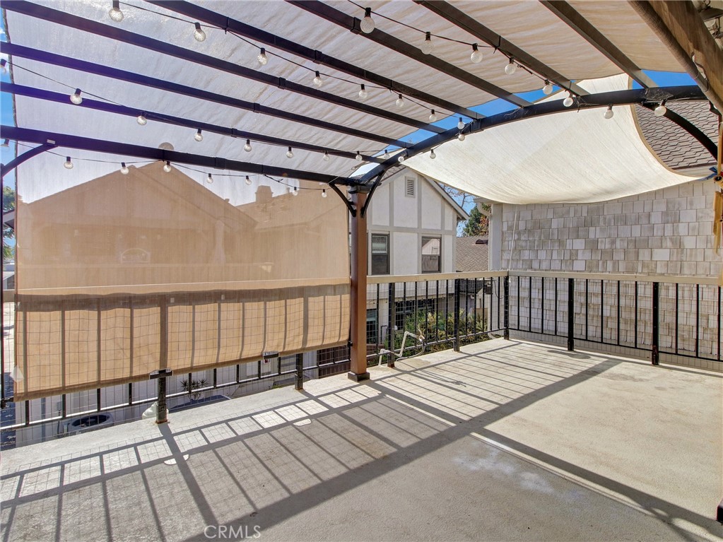 9051 Cobblestone Lane, Unit 40 Cypress, CA 90630 - Photo 28 of 38 a balcony with view of wooden floor