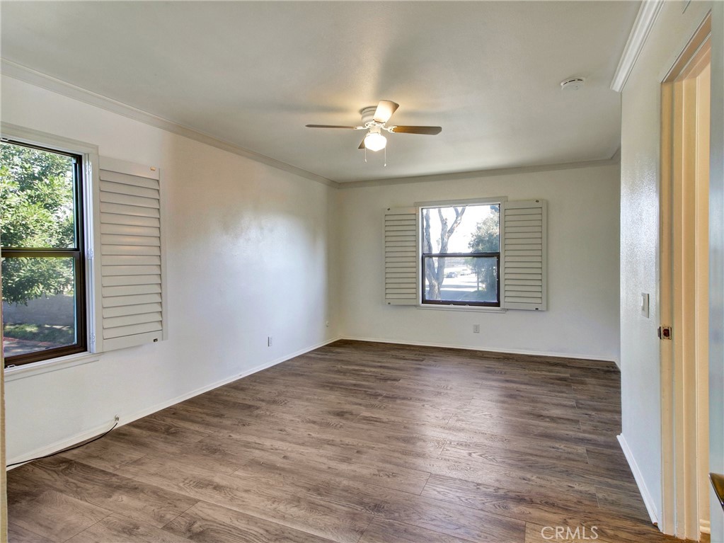 9051 Cobblestone Lane, Unit 40 Cypress, CA 90630 - Photo 30 of 38 wooden floor in an empty room with a window