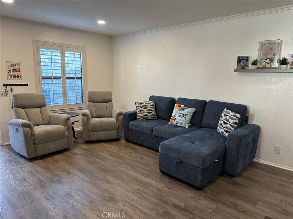 9051 Cobblestone Lane, Unit 40 Cypress, CA 90630 - Photo 4 of 38 a living room with furniture and a window